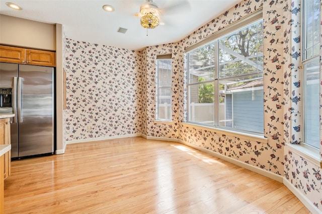 2704 Chambray Ln, Tampa, FL 33611 - unfurnished dining area with wallpapered walls, a ceiling fan, light wood-style flooring, baseboards, and recessed lighting