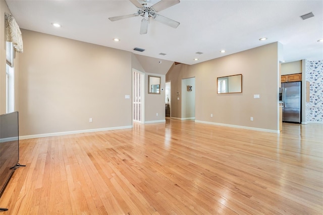 2704 Chambray Ln, Tampa, FL 33611 - unfurnished living room featuring light wood-type flooring, a ceiling fan, recessed lighting, and baseboards