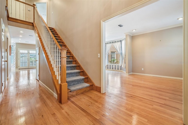 2704 Chambray Ln, Tampa, FL 33611 - stairway with wood finished floors, baseboards, and ornamental molding