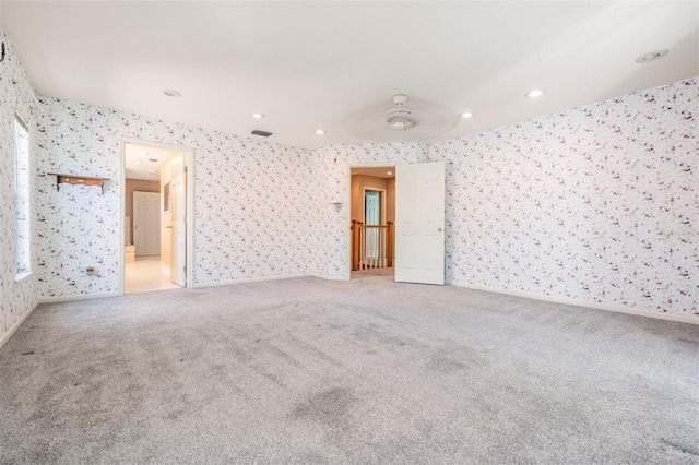 2704 Chambray Ln, Tampa, FL 33611 - unfurnished room with wallpapered walls, light carpet, recessed lighting, and baseboards