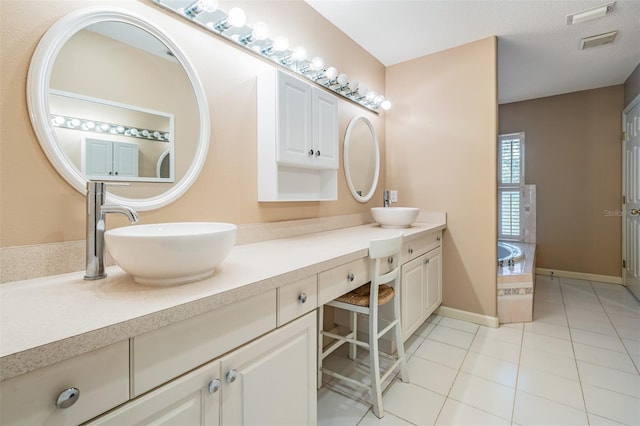 2704 Chambray Ln, Tampa, FL 33611 - full bathroom with double vanity, tile patterned floors, and a garden tub