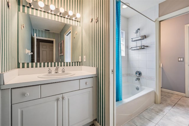 2704 Chambray Ln, Tampa, FL 33611 - full bathroom with tile patterned flooring, bathing tub / shower combination, vanity, and baseboards