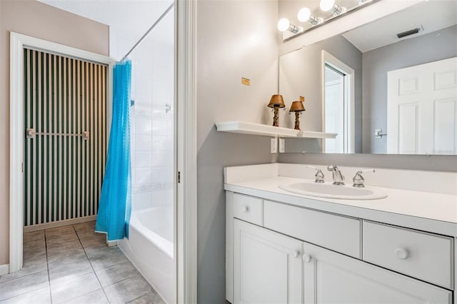 2704 Chambray Ln, Tampa, FL 33611 - bathroom with tile patterned flooring, shower / bath combo with shower curtain, and vanity