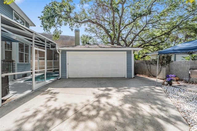 2704 Chambray Ln, Tampa, FL 33611 - detached garage featuring fence