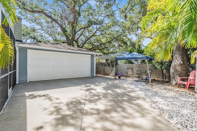 2704 Chambray Ln, Tampa, FL 33611 - detached garage featuring fence