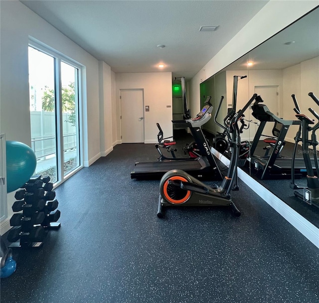 workout area featuring visible vents and baseboards