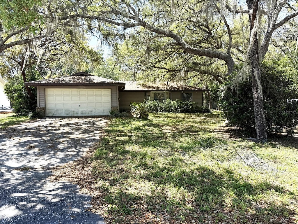 view of front of home featuring an attached garage and driveway