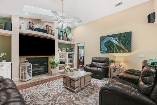 1004 Hollyberry Ct, Brandon, FL 33511 - living area with a ceiling fan, a skylight, wood finished floors, built in features, and a fireplace