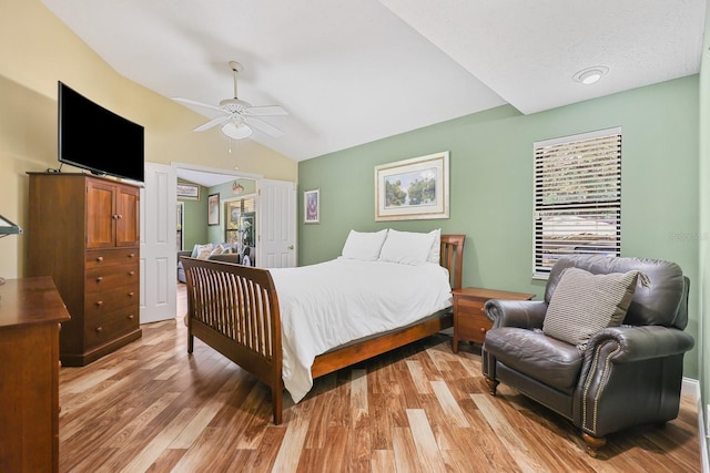1004 Hollyberry Ct, Brandon, FL 33511 - bedroom featuring vaulted ceiling, light wood-style flooring, and a ceiling fan