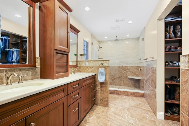 1004 Hollyberry Ct, Brandon, FL 33511 - full bathroom featuring double vanity, a tile shower, recessed lighting, a spacious closet, and marble finish floors