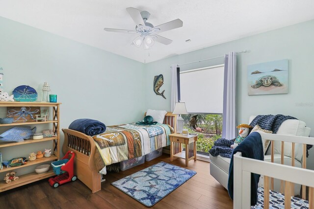 1004 Hollyberry Ct, Brandon, FL 33511 - bedroom featuring wood finished floors, a ceiling fan, and baseboard heating