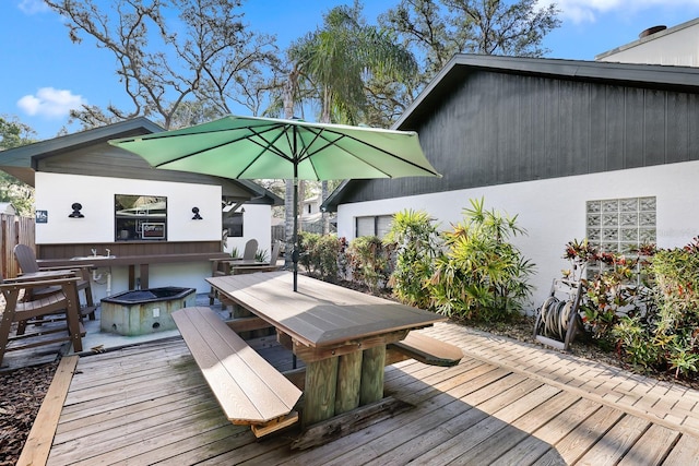 1004 Hollyberry Ct, Brandon, FL 33511 - wooden terrace featuring a fire pit and outdoor dining space