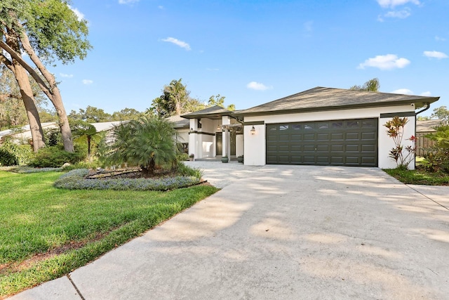 1004 Hollyberry Ct, Brandon, FL 33511 - view of front of property with concrete driveway, an attached garage, stucco siding, and a front lawn