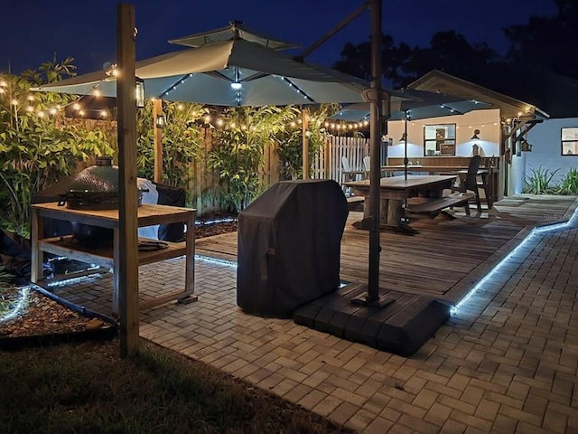 1004 Hollyberry Ct, Brandon, FL 33511 - patio at twilight featuring a wooden deck and outdoor dining area