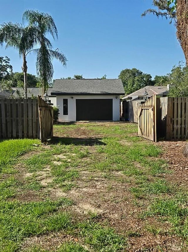 1004 Hollyberry Ct, Brandon, FL 33511 - view of yard featuring an outbuilding and a garage