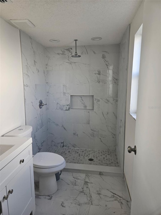 6241 Westport Dr, Port Richey, FL 34668 - bathroom with a stall shower, marble finish floor, a textured ceiling, and toilet