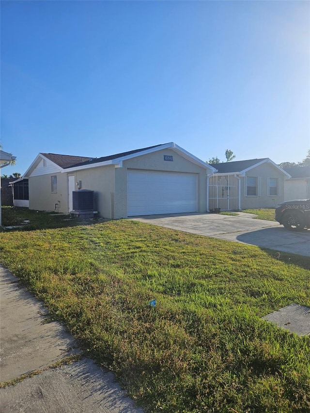 6241 Westport Dr, Port Richey, FL 34668 - view of front facade with stucco siding, concrete driveway, a front lawn, and central AC unit