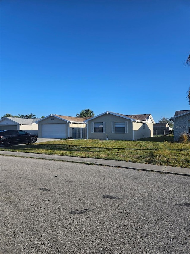 6241 Westport Dr, Port Richey, FL 34668 - view of front of house featuring a front yard and fence