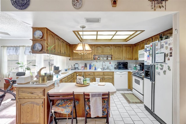 kitchen featuring open shelves, a sink, white appliances, light countertops, and visible vents