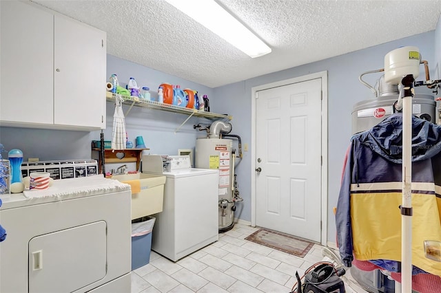 laundry area with washer and clothes dryer, a textured ceiling, a sink, water heater, and cabinet space