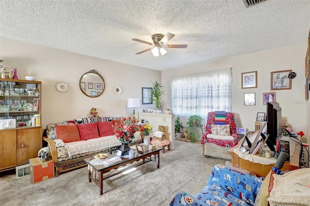 carpeted living room featuring a textured ceiling, a ceiling fan, and visible vents