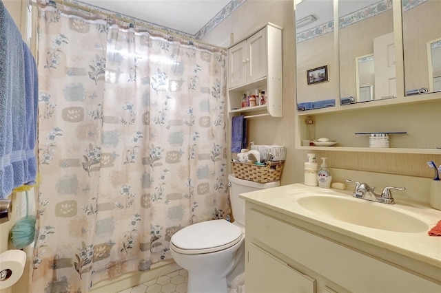 full bathroom featuring toilet, tile patterned floors, vanity, and a shower with shower curtain