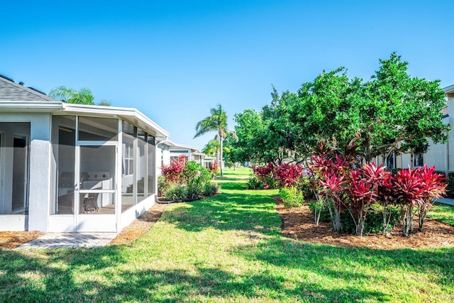 view of yard with a sunroom