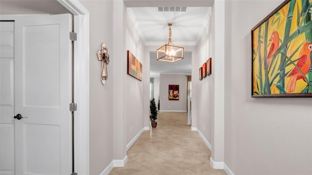 11720 Navajo Sandstone St, Riverview, FL 33579 - hall featuring crown molding, baseboards, visible vents, and a notable chandelier