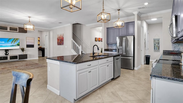 11720 Navajo Sandstone St, Riverview, FL 33579 - kitchen featuring light tile patterned floors, appliances with stainless steel finishes, a sink, and visible vents