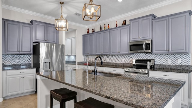 11720 Navajo Sandstone St, Riverview, FL 33579 - kitchen featuring an inviting chandelier, pendant lighting, a sink, dark stone countertops, and stainless steel appliances