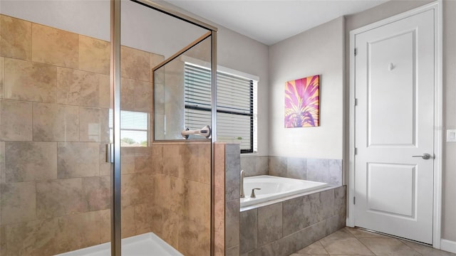 11720 Navajo Sandstone St, Riverview, FL 33579 - full bath with tile patterned flooring, a bath, and a stall shower