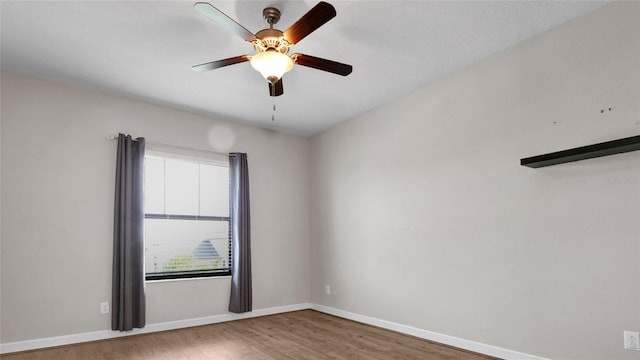 11720 Navajo Sandstone St, Riverview, FL 33579 - unfurnished room with baseboards, ceiling fan, and wood finished floors