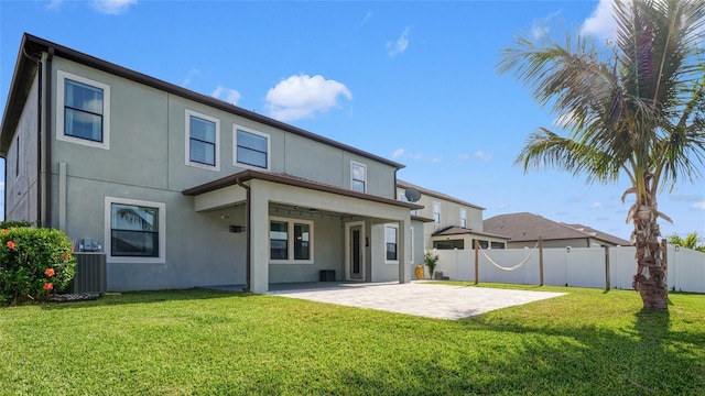 11720 Navajo Sandstone St, Riverview, FL 33579 - rear view of house featuring a patio, stucco siding, a yard, and fence