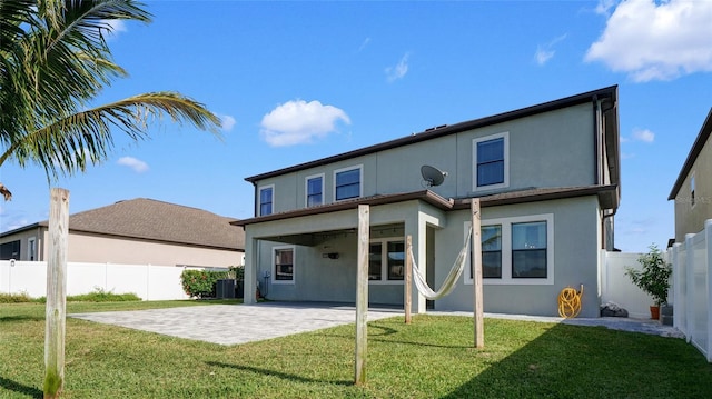 11720 Navajo Sandstone St, Riverview, FL 33579 - rear view of house with a fenced backyard, a patio area, stucco siding, and a yard