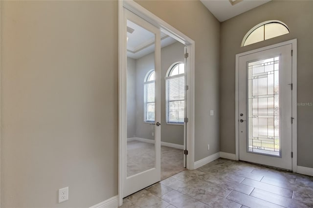4975 Night Star Trl, Odessa, FL 33556 - foyer entrance featuring light tile patterned floors and baseboards