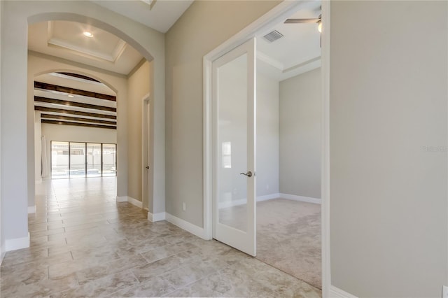 4975 Night Star Trl, Odessa, FL 33556 - hall with arched walkways, french doors, baseboards, and beamed ceiling