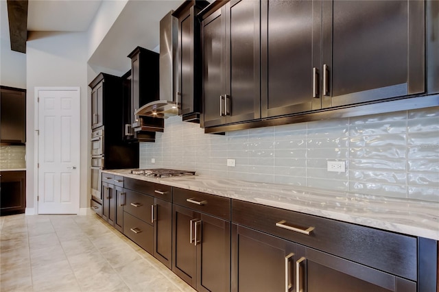 4975 Night Star Trl, Odessa, FL 33556 - kitchen featuring light stone countertops, tasteful backsplash, appliances with stainless steel finishes, and light tile patterned floors