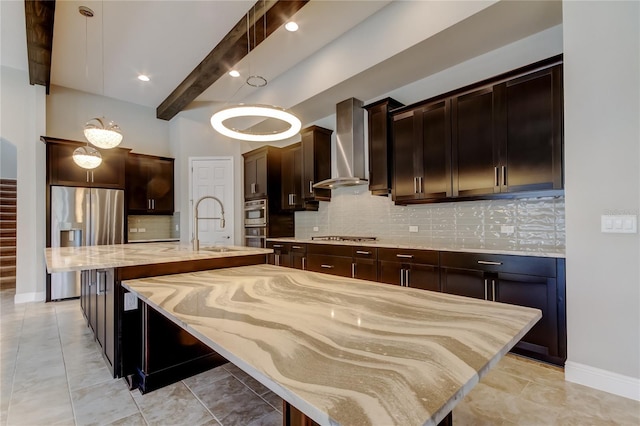 4975 Night Star Trl, Odessa, FL 33556 - kitchen featuring wall chimney exhaust hood, stainless steel appliances, a large island with sink, tasteful backsplash, and a kitchen bar