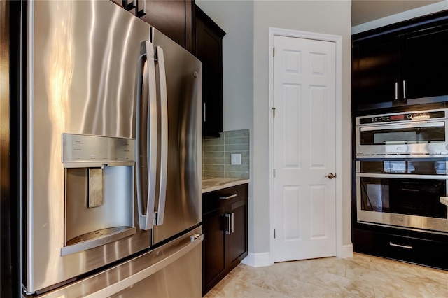 4975 Night Star Trl, Odessa, FL 33556 - kitchen with stainless steel appliances and tasteful backsplash
