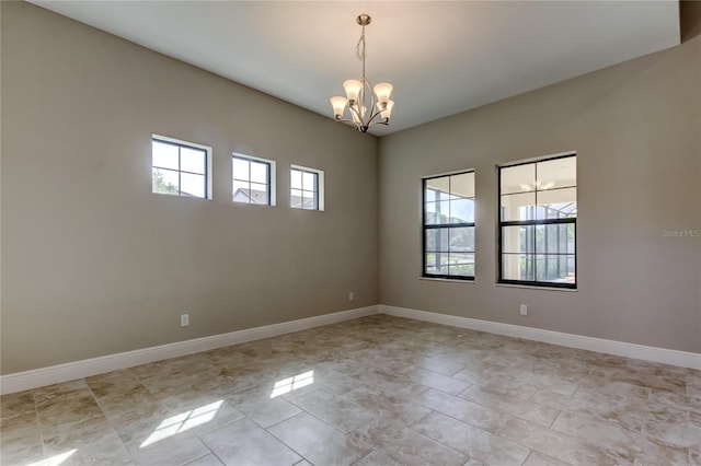 4975 Night Star Trl, Odessa, FL 33556 - unfurnished room featuring a chandelier and baseboards