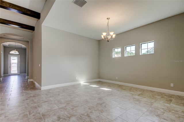 4975 Night Star Trl, Odessa, FL 33556 - empty room with plenty of natural light, a chandelier, arched walkways, and baseboards