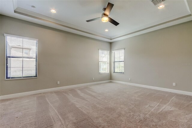 4975 Night Star Trl, Odessa, FL 33556 - spare room with a raised ceiling, light colored carpet, a ceiling fan, baseboards, and recessed lighting