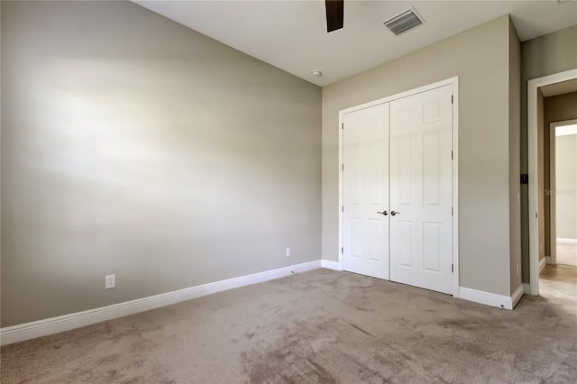 4975 Night Star Trl, Odessa, FL 33556 - unfurnished bedroom featuring carpet, a closet, baseboards, and ceiling fan