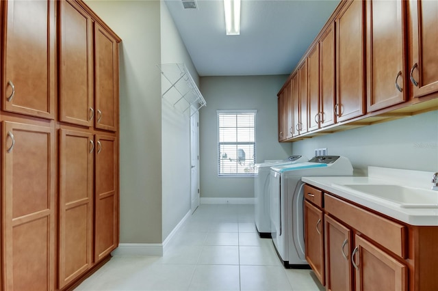4975 Night Star Trl, Odessa, FL 33556 - laundry room with cabinet space, washing machine and dryer, baseboards, and light tile patterned floors