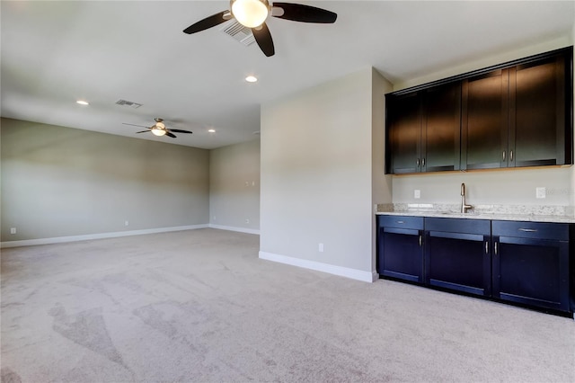 4975 Night Star Trl, Odessa, FL 33556 - spare room with ceiling fan, light carpet, a sink, baseboards, and recessed lighting