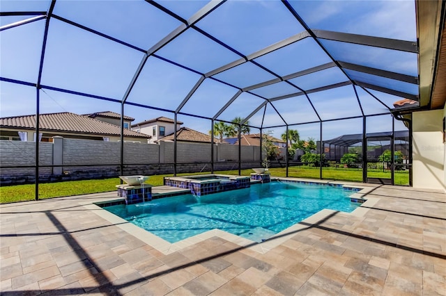 4975 Night Star Trl, Odessa, FL 33556 - view of swimming pool featuring a patio area, a pool with connected hot tub, and a lanai