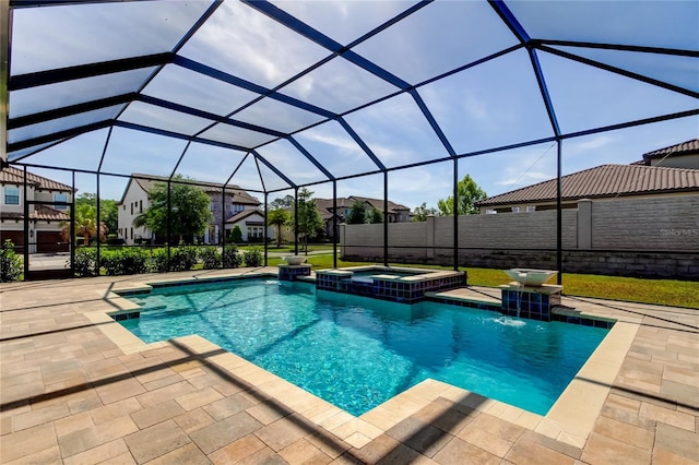 4975 Night Star Trl, Odessa, FL 33556 - view of pool featuring a pool with connected hot tub, a patio, and a lanai