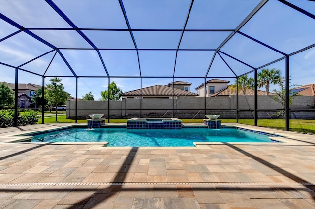 4975 Night Star Trl, Odessa, FL 33556 - view of swimming pool with a patio area, a pool with connected hot tub, a lanai, and a fenced backyard