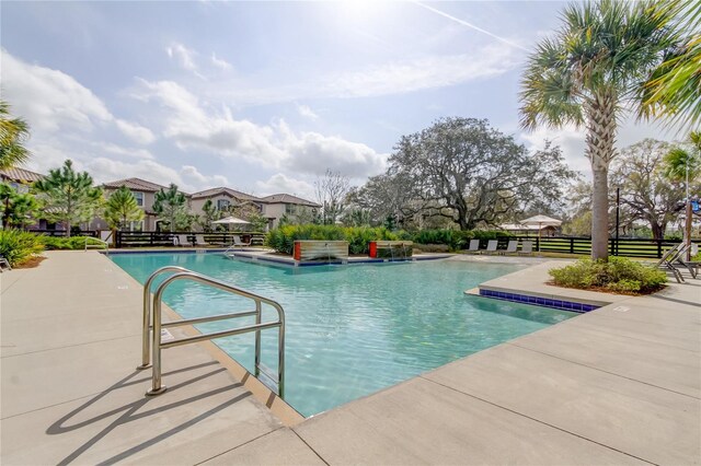 4975 Night Star Trl, Odessa, FL 33556 - community pool with fence and a patio area
