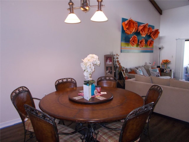 dining area featuring baseboards and wood finished floors